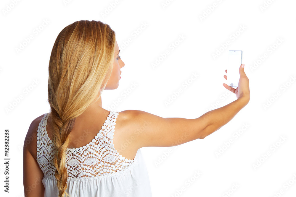Blond tourist girl taking photos with smartphone Blond tourist girl taking photos with smartphone