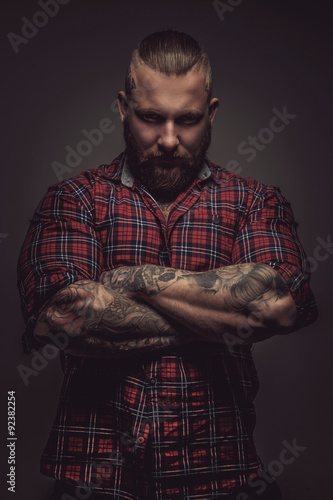 Man with beard and tattoo. photo