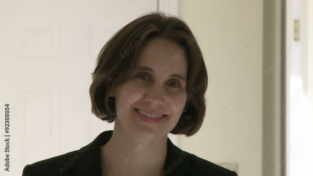 Office Female looking straight at camera with a broad smile Office Female looking straight at camera with a broad smile