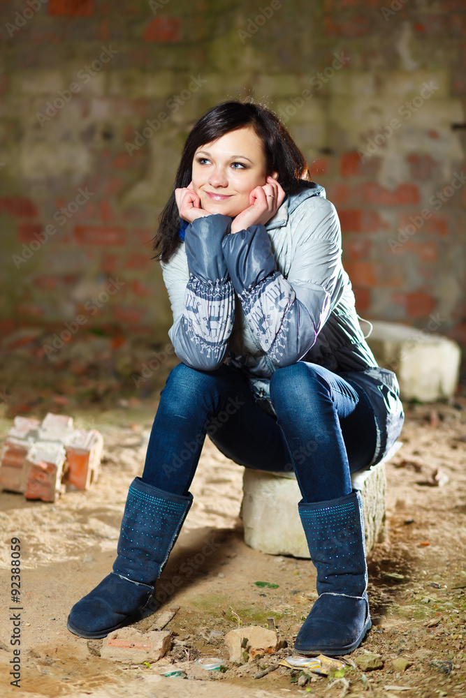 Brunette girl posing at abandoned ruins. Brunette girl posing at abandoned ruins.