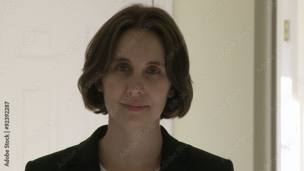 Office Female Looking straight at camera with a slight smile Office Female Looking straight at camera with a slight smile