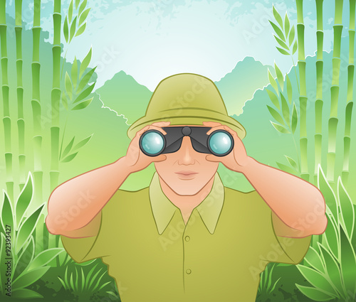 The Traveler. Young man in hiking clothes, looking through binoculars, on mountainscape background.