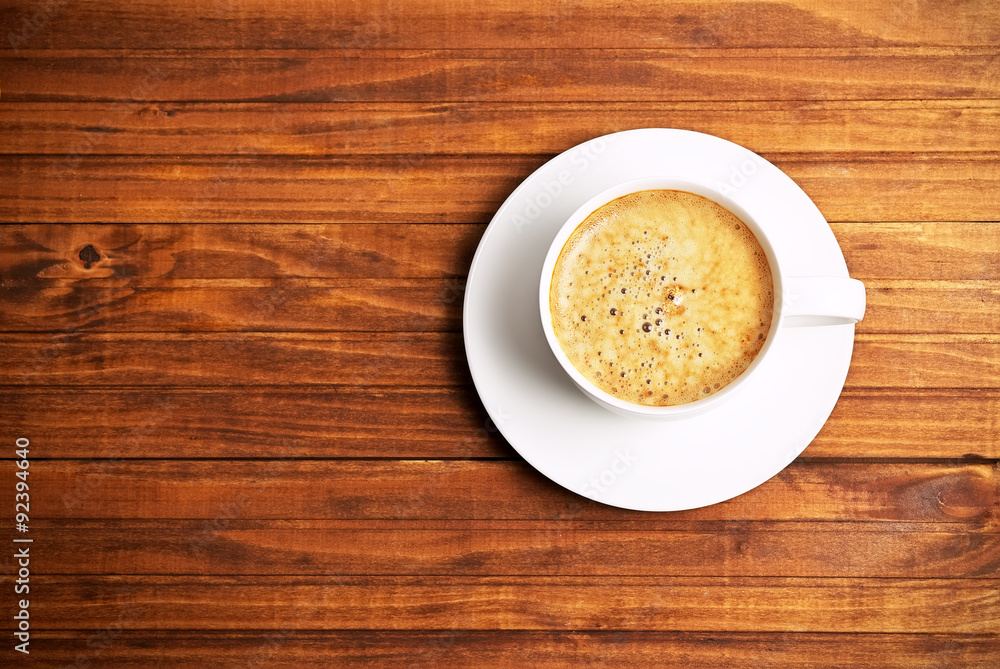 Cup of coffe on wooden background. Concept photo, top view Cup of coffe on wooden background. Concept photo, top view