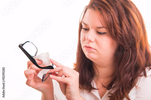 Woman clean glasses using wet cloth