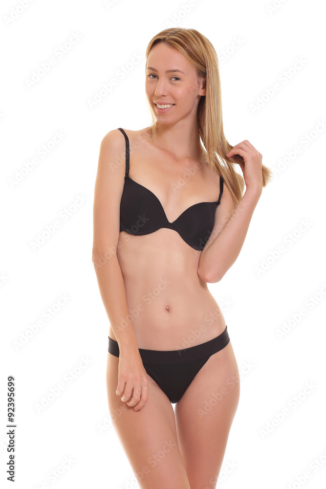 young blond woman posing in black lingerie. young blond woman posing in black lingerie.