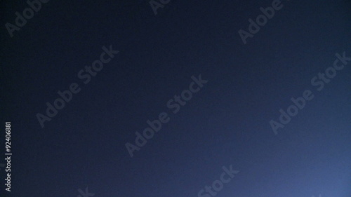 Plane flies overhead at night