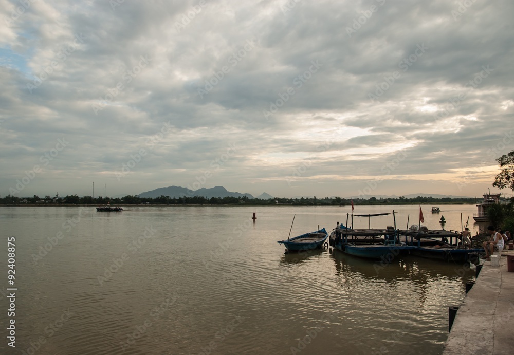 Cloudy sunset on the Thu Bon river. Hoi An, Vietnam.