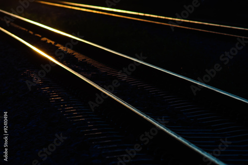 railway tracks in the shadow light of sunset.