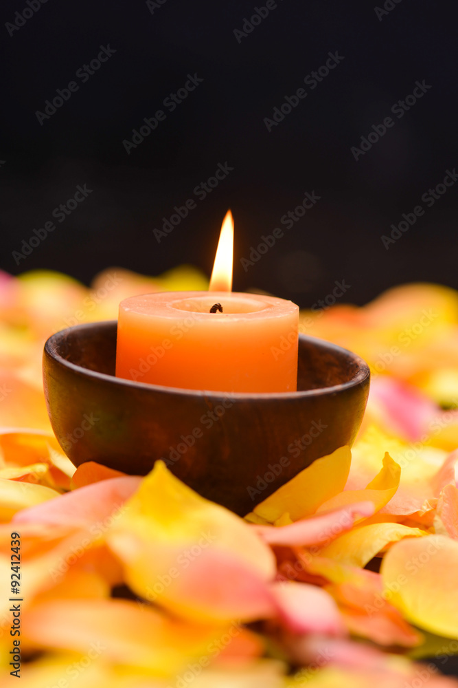 rose petals with four candle in basket on mat rose petals with four candle in basket on mat