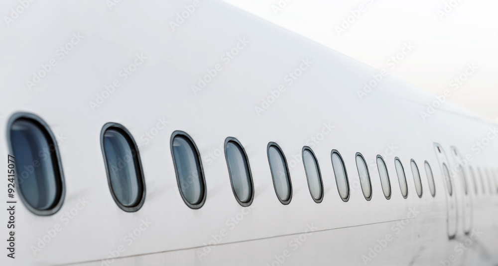 Fototapeta premium Passenger aircraft windows. View from outside.