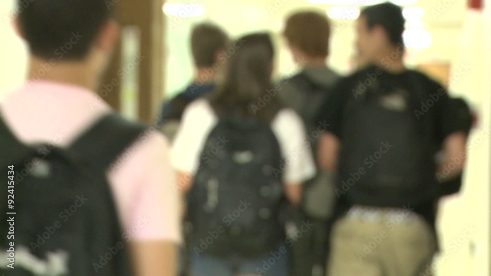 Junior high students walking down hallway Junior high students walking down hallway