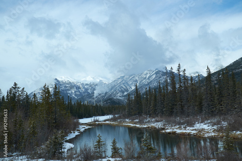 Canadian landscape with Rockies Mountains and a lake with reflections © bear & tripod