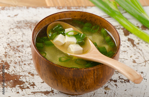 Fotografi Miso soup on a wooden table.