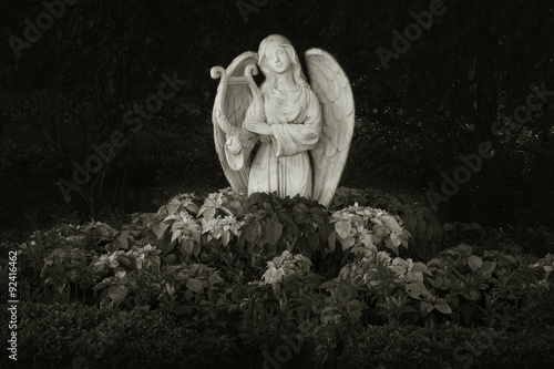 Sculpture of angel in dark