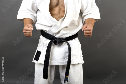 Young man in white kimono and black belt training martial art Stock Photo |  Adobe Stock