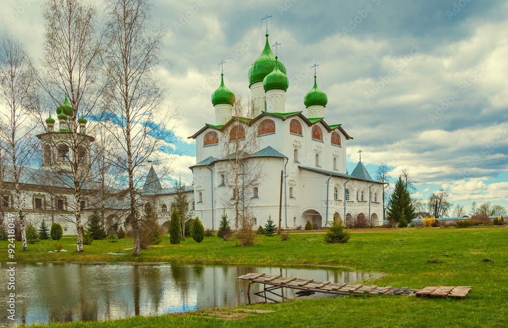 near Veliky Novgorod is beautiful ensemble Vyazhischskogo monastery, built in upper reaches of river Veryazhi. magnificent buildings of monastery solemnly look at background of surrounding nature.