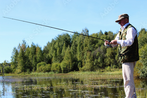 spinning fisherman lake landscape