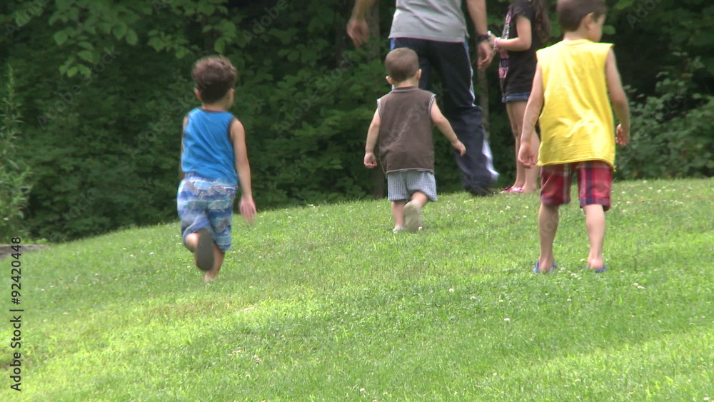 Man with his children walking in a Nature Reserve Man with his children walking in a Nature Reserve