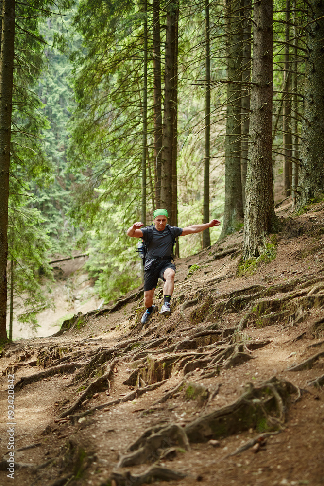 Man doing trail running in the forest