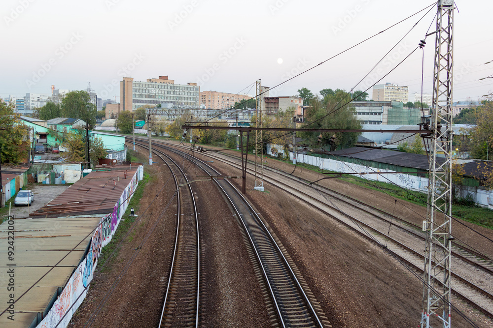 evening railway track curve in city