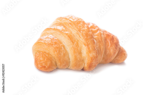Fresh and tasty croissant on white background