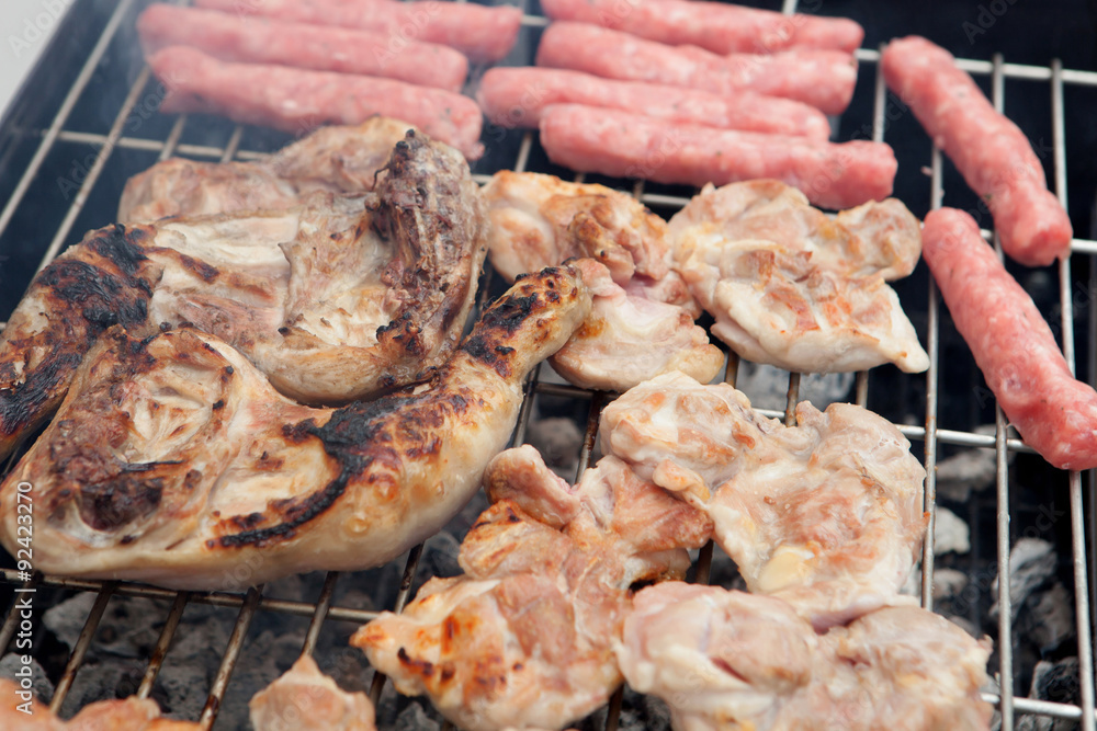 Chicken and sausages on the barbecue