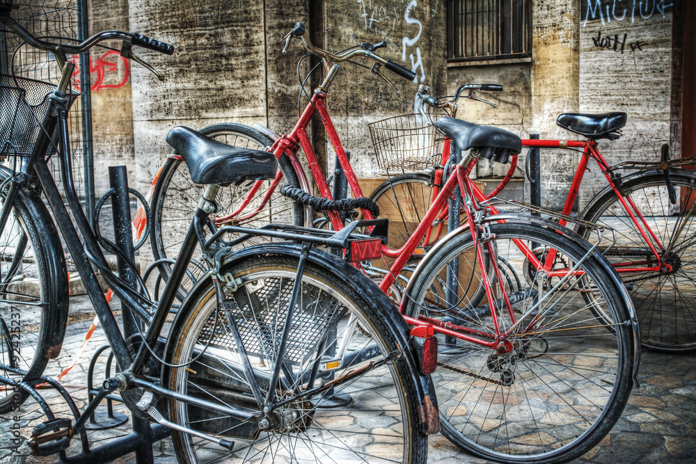classic bicycles on a bike rack in Bologna