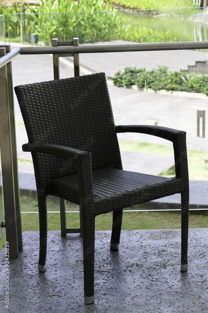 black rattan chair on the terrace black rattan chair on the terrace