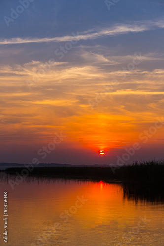 Sunset over the lake © idea_studio