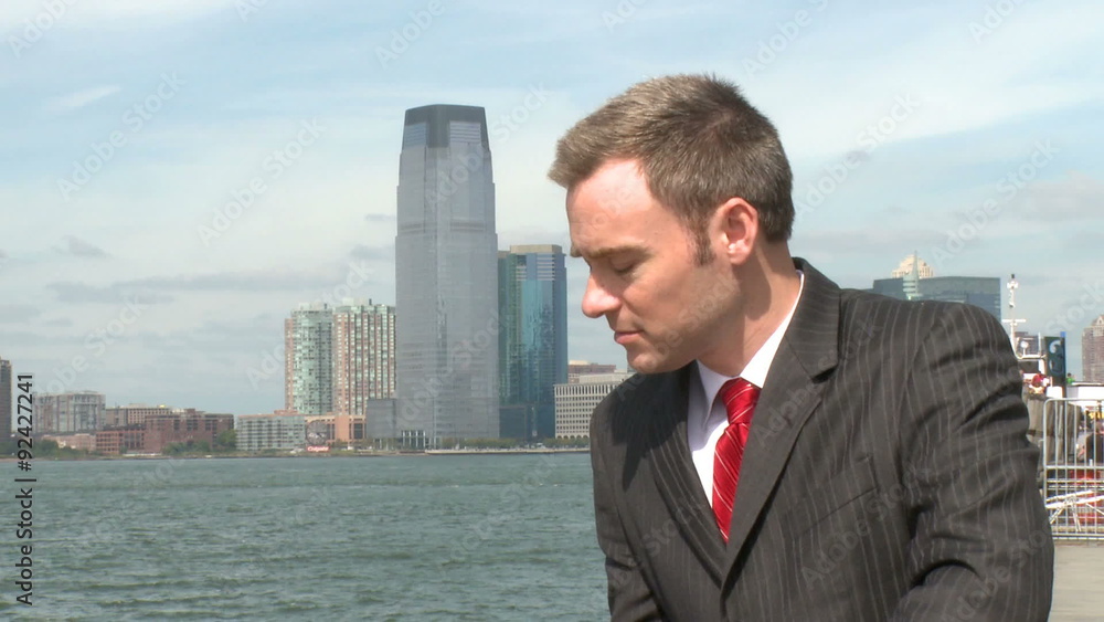 Stressed male professional by the waterfront Stressed male professional by the waterfront