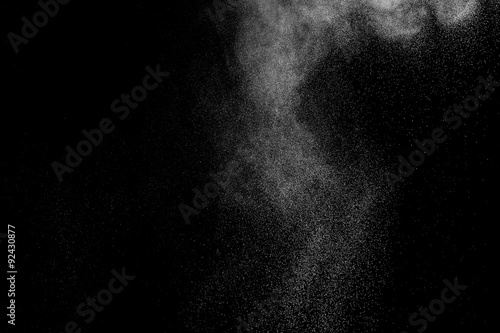 abstract white dust explosion on a black background. abstract white powder. design elements. abstract texture.