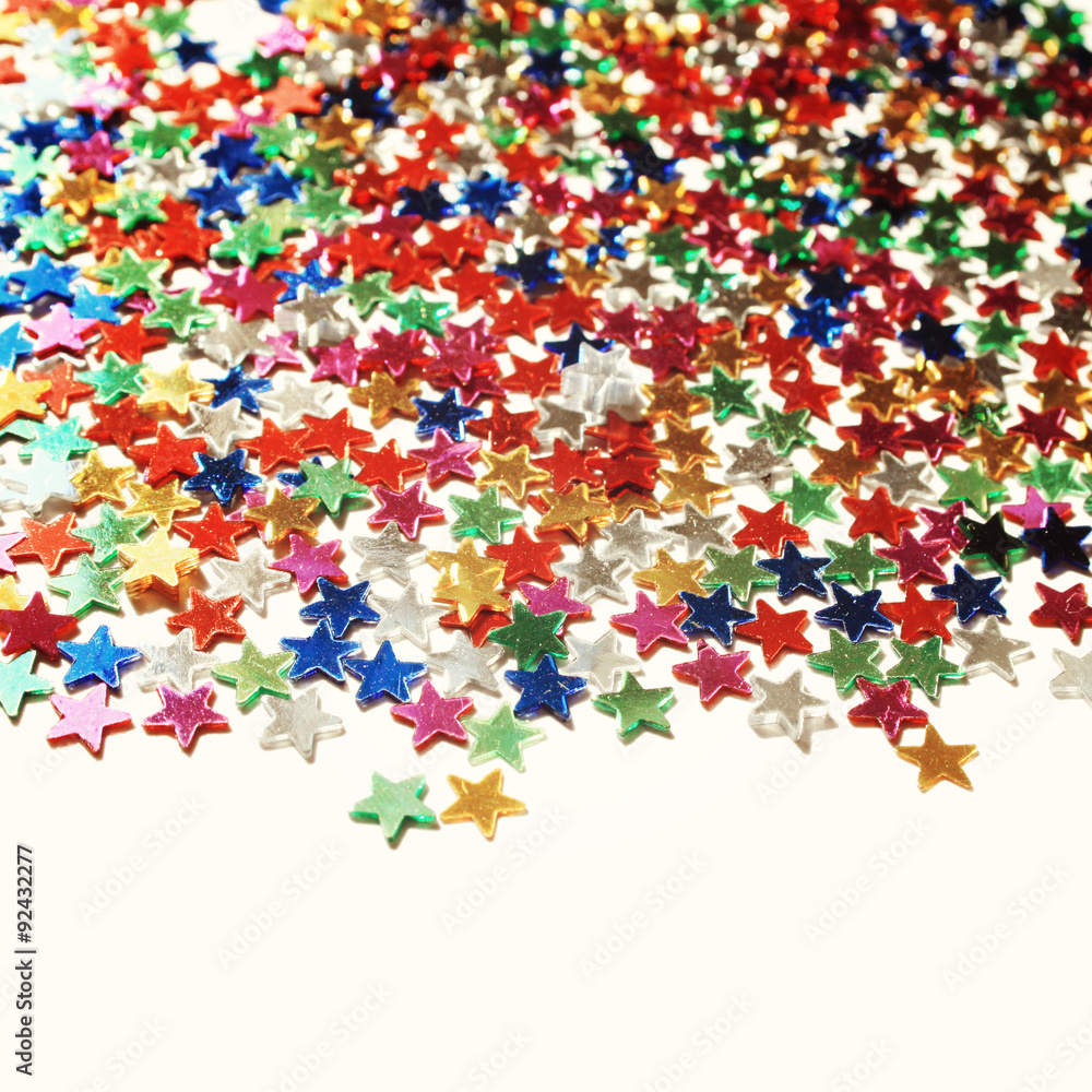 Star background with copy space. Macro. Scattered glittering stars confetti. Vintage photo. Text frame with plenty of colorful stars. Star background with copy space. Macro. Scattered glittering stars confetti. Vintage photo. Text frame with plenty of colorful stars.