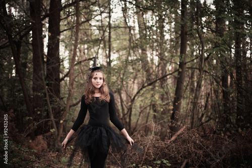 young witch in forest