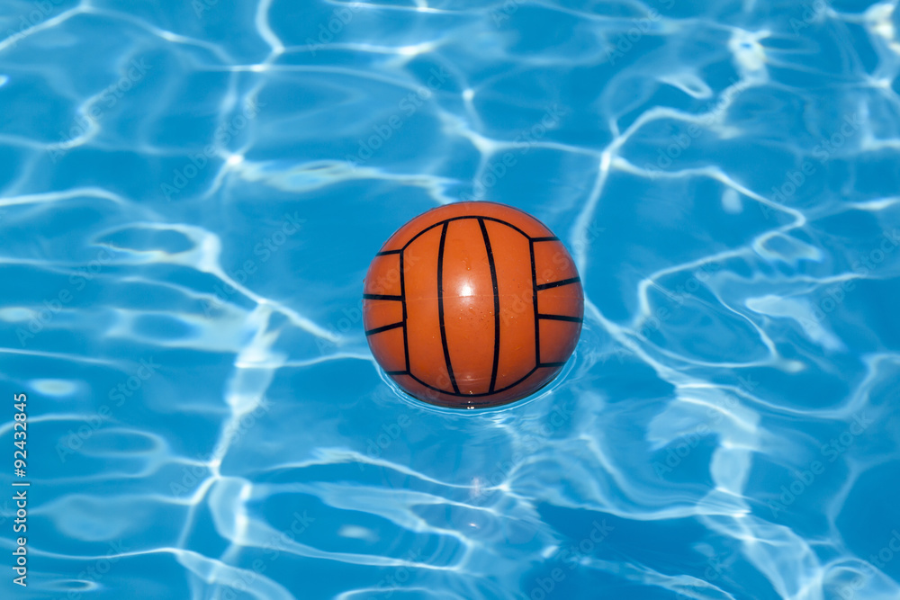 waterball in shwimming pool in sunshine