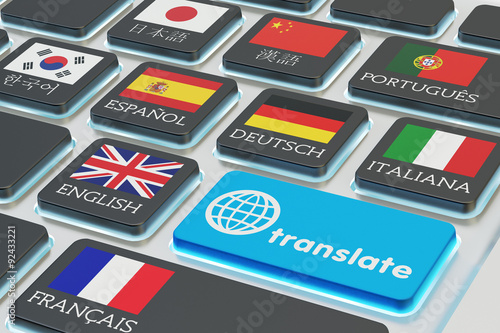 Foreign languages translation concept, online translator, macro view of computer keyboard with national flags of world countries on keys and blue translate button
