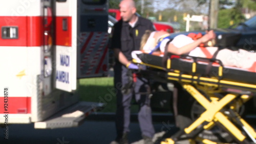Woman moved by stretcher into ambulance