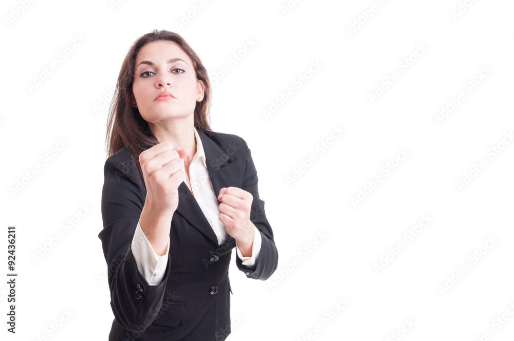 Young business woman acting aggressive showing fists Young business woman acting aggressive showing fists