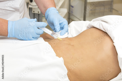 woman is in the process cellulite mesotherapy clinic