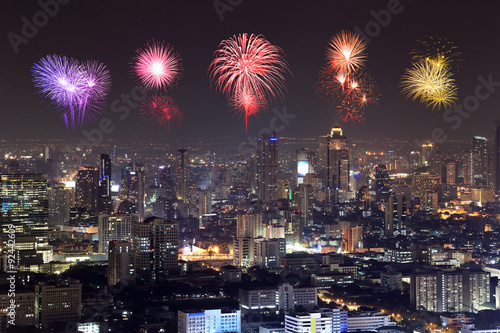 Fireworks celebrating over Bangkok cityscape at night