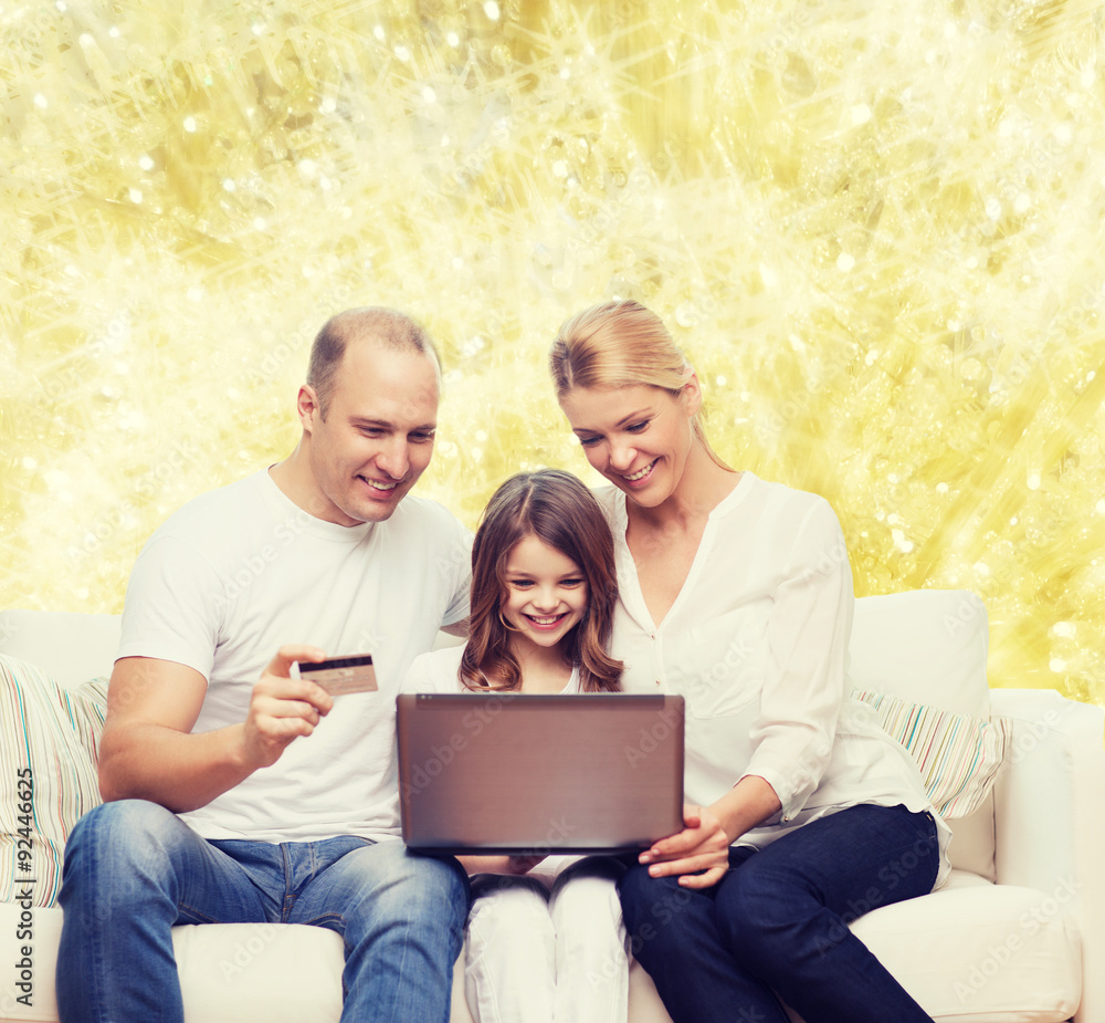 happy family with laptop computer and credit card happy family with laptop computer and credit card