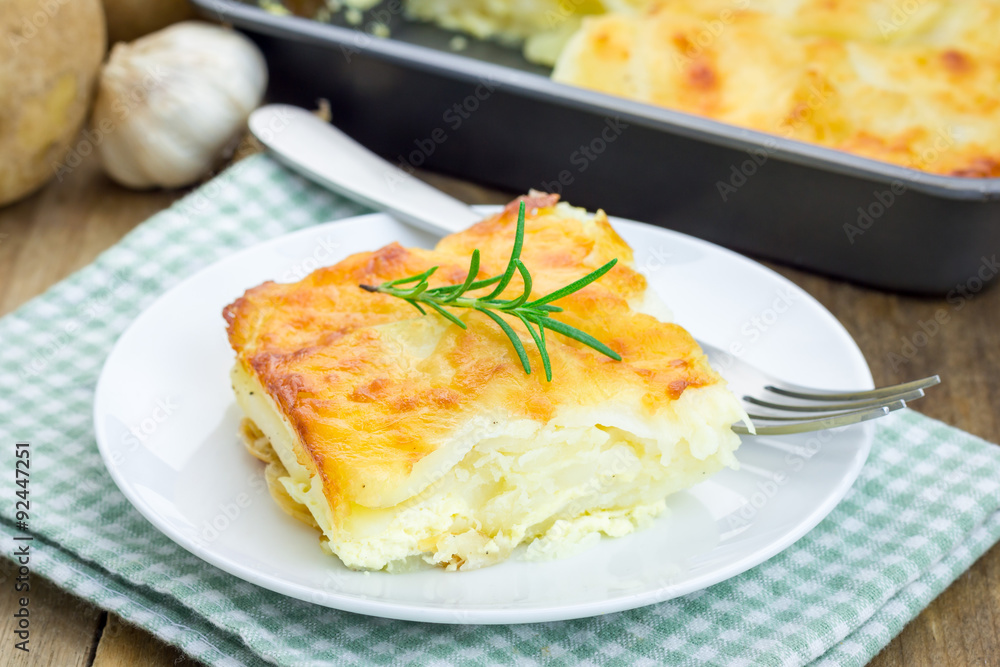 Potato gratin on a white plate Potato gratin on a white plate