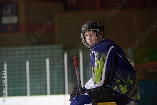Canvas Print ice hockey players on bench