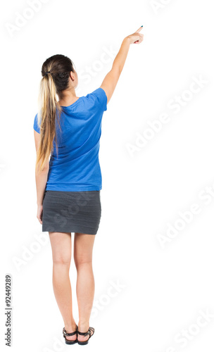 Back view of  pointing woman.