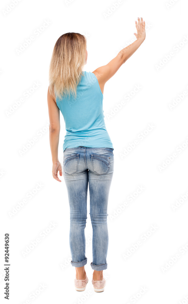 Back view of beautiful woman welcomes. Back view of beautiful woman welcomes.