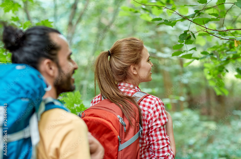 group of smiling friends with backpacks hiking group of smiling friends with backpacks hiking