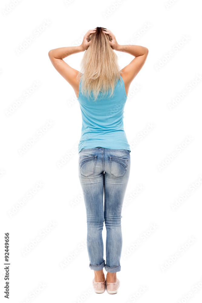 Back view of shocked woman in jeans. Back view of shocked woman in jeans.