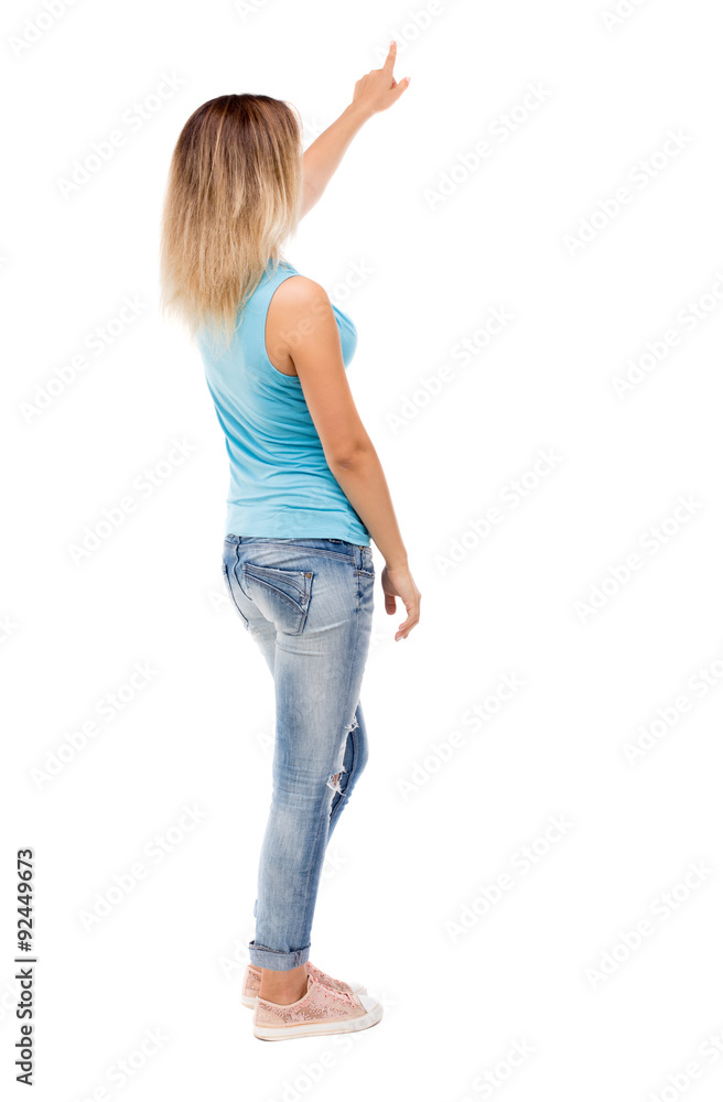 Back view of pointing woman. Back view of pointing woman.