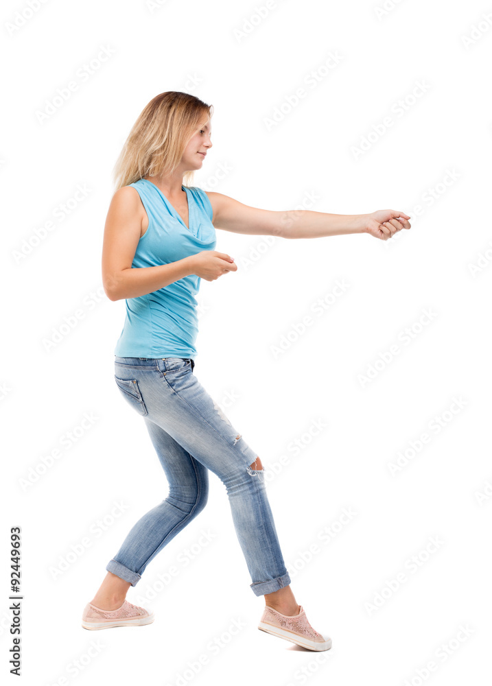 back view of standing girl pulling a rope from the top or cling back view of standing girl pulling a rope from the top or cling