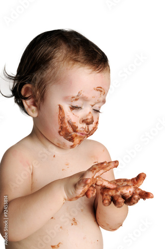 Baby enjoying the moment  eating chocolate
