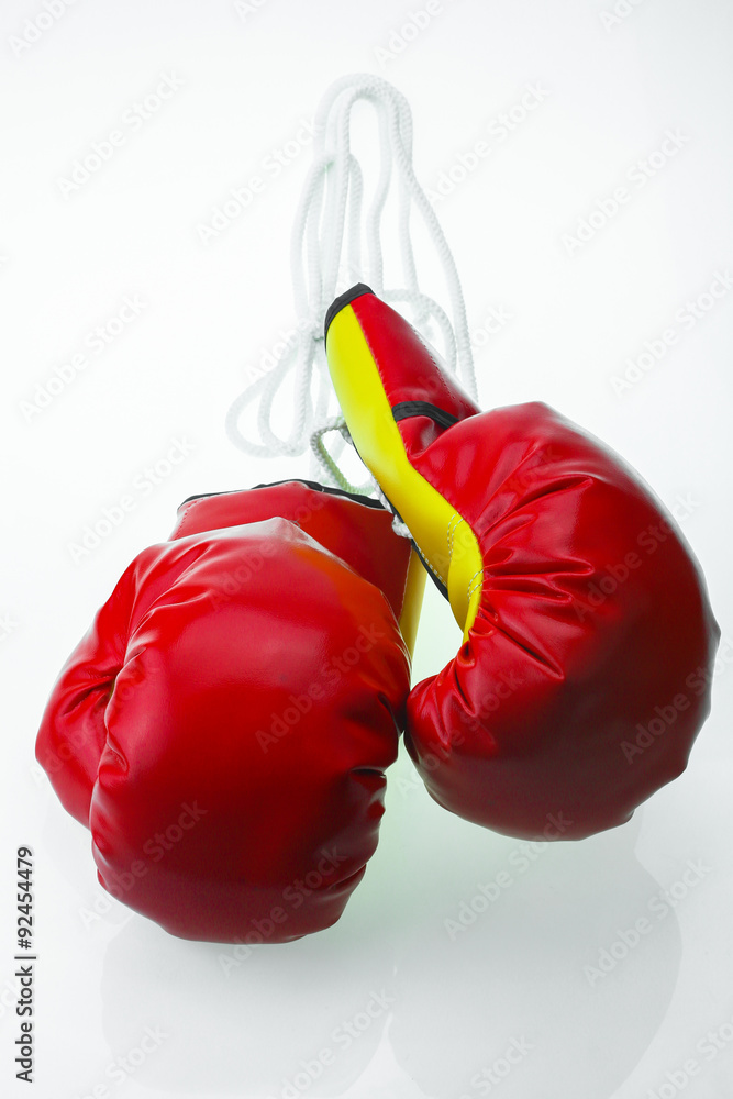 Red leather boxing gloves isolated , Boxing gloves background, popular sport for fighter.